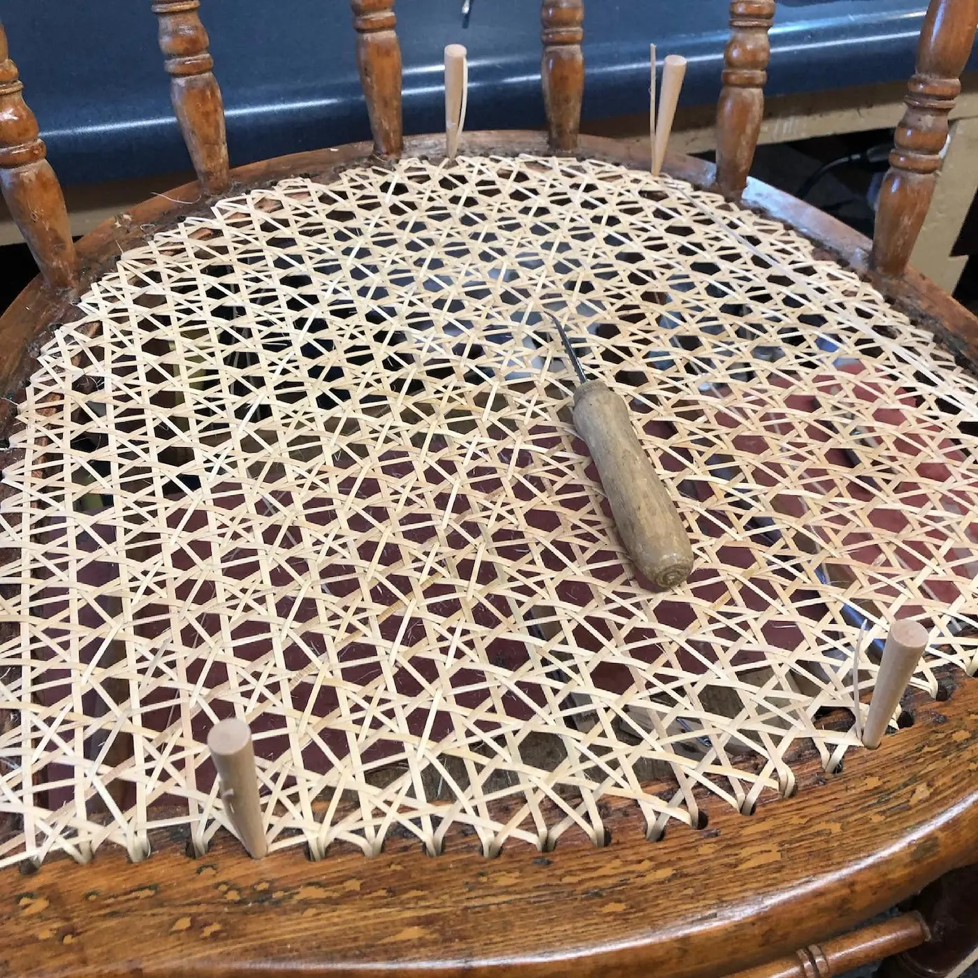 Hand-woven cane chair seat